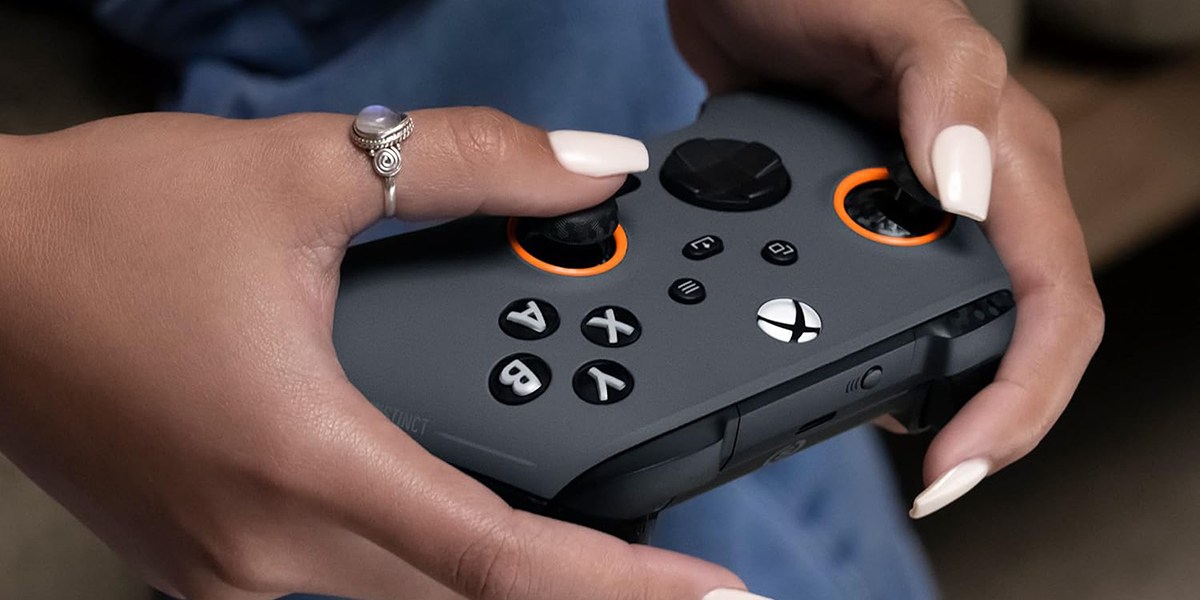 Hands holding SCUF Instinct Pro Performance Series Wireless Xbox Controller