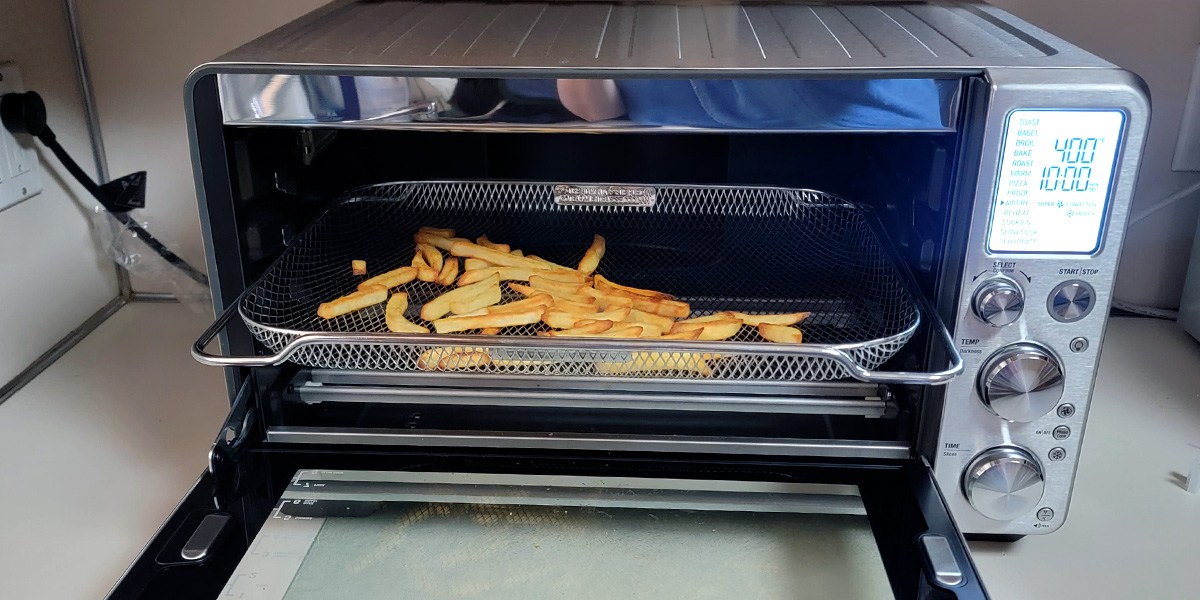 Breville Smart Oven Air Fryer Pro with open door and basket of fries on the inside Breville Smart Oven Air Fryer Pro with open door and basket of fries on the inside