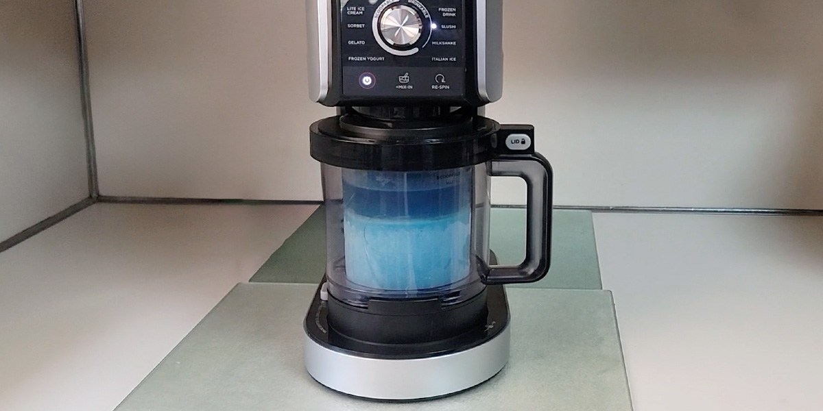 Front view of Ninja NC501 Creami Deluxe with blue slushie treat inside