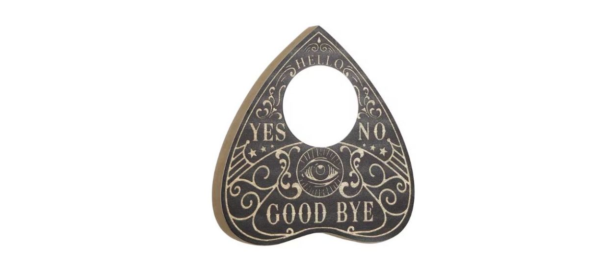 A tabletop decoration shaped like a ouija planchette 