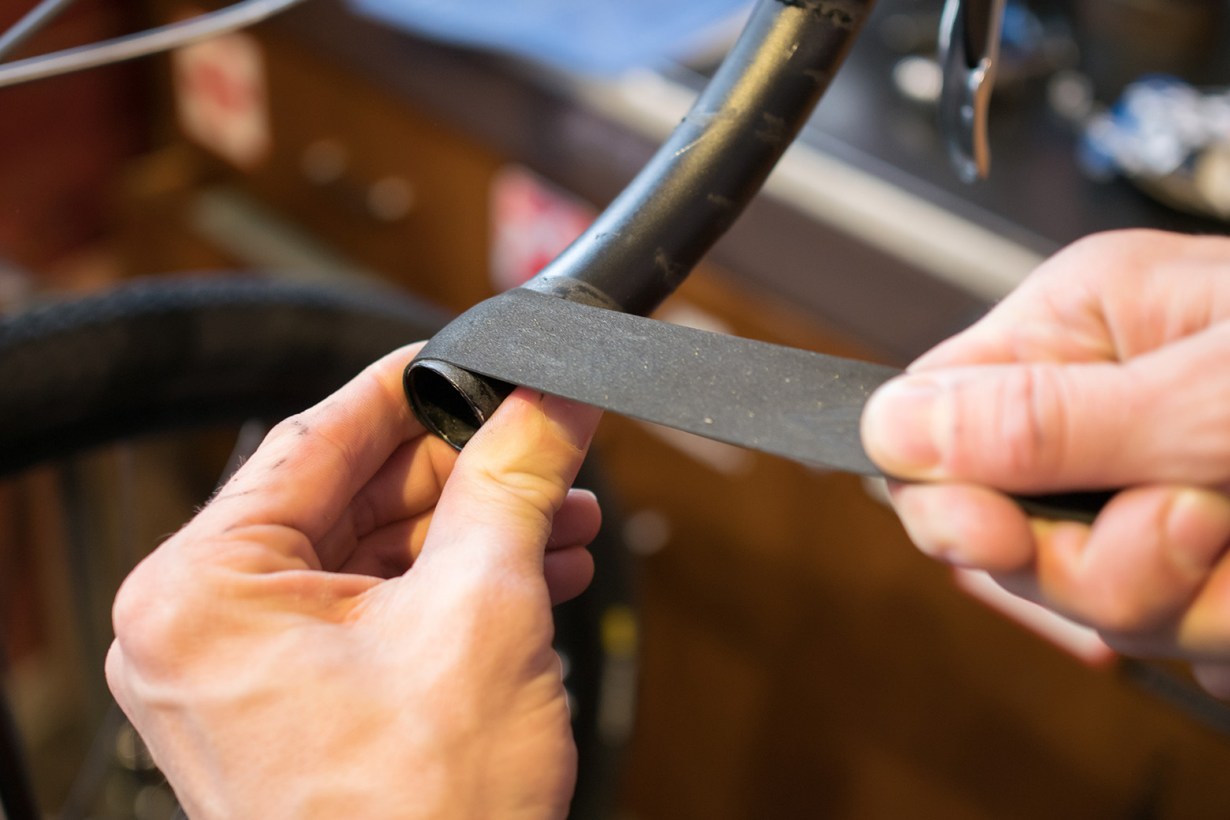 hands using electrical tape