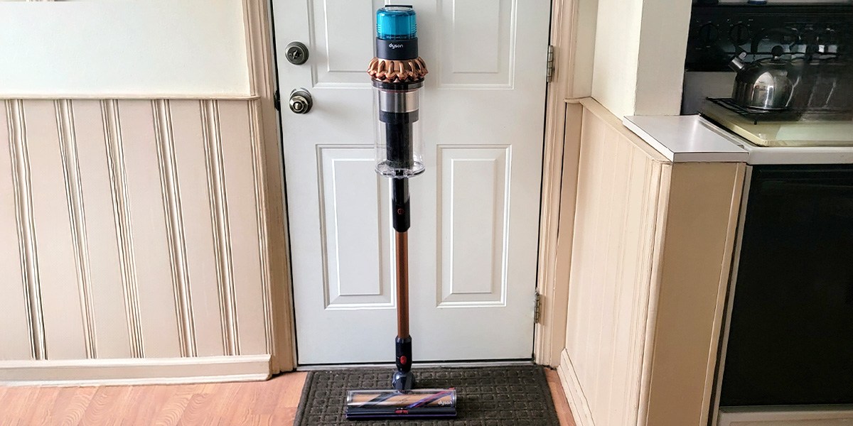 Dyson Gen5outsize Absolute leaning against door