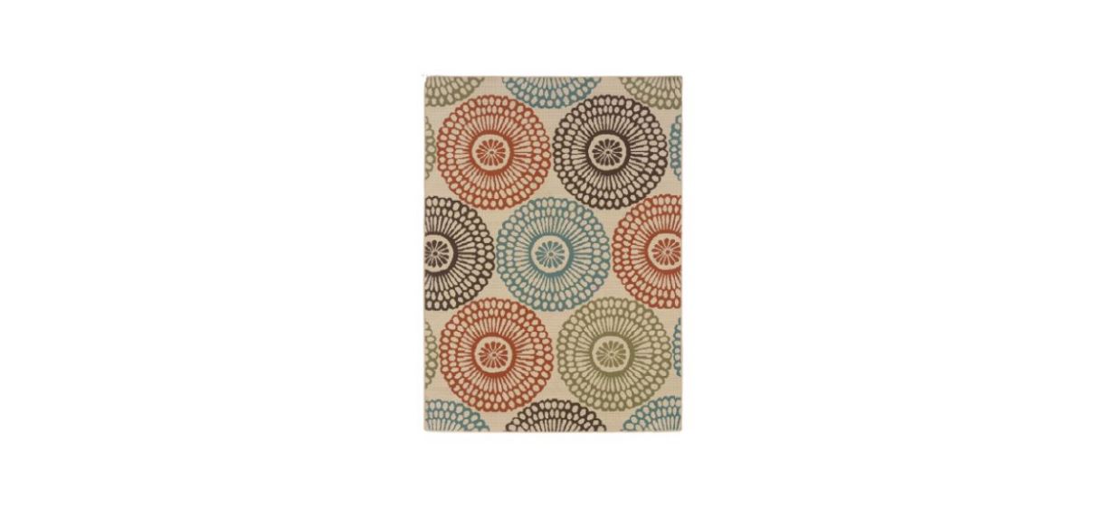 a floral rug with a beige background